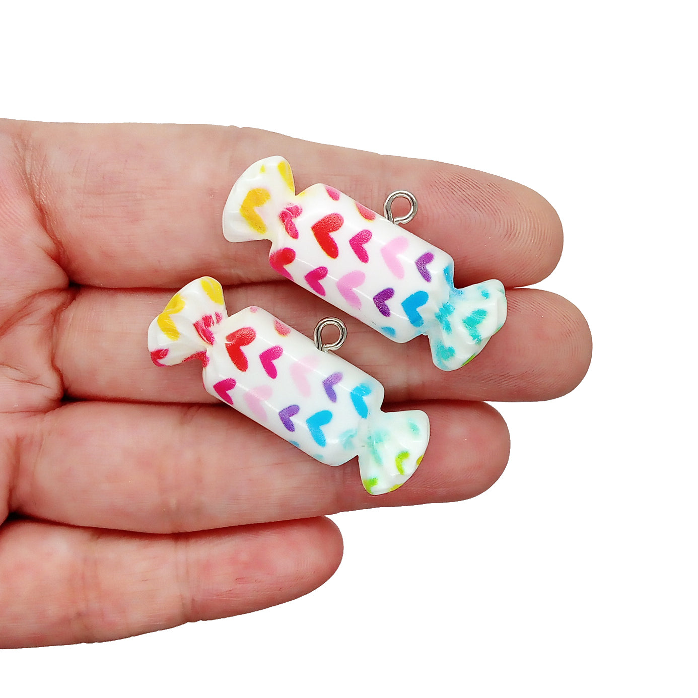 Cute candy charms with rainbow hearts.