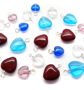 Heart Charms made from dark red, aqua, blue, clear and amethyst colored glass beads.