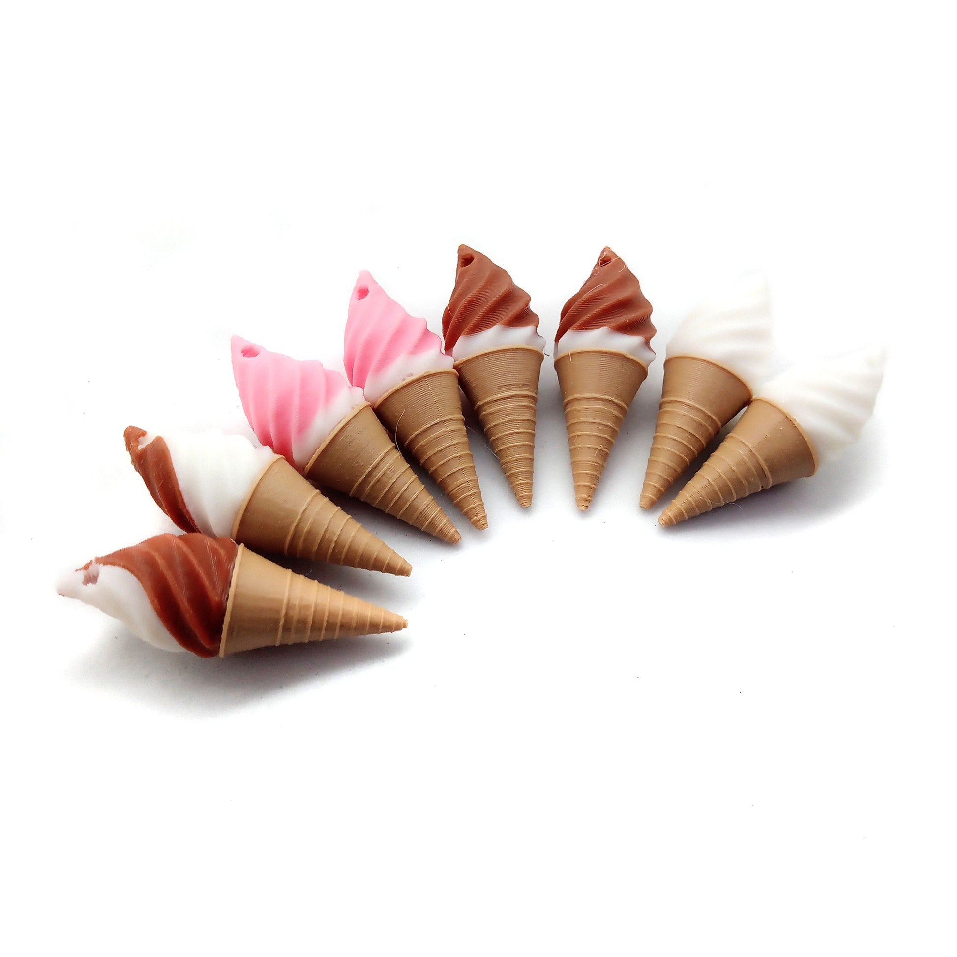 Small ice cream cone charms: vanilla, strawberry dipped, chocolate dipped, and chocolate/vanilla swirl.