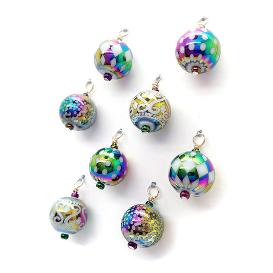 Pretty rainbow metallic shiny miniature Christmas ornaments.
