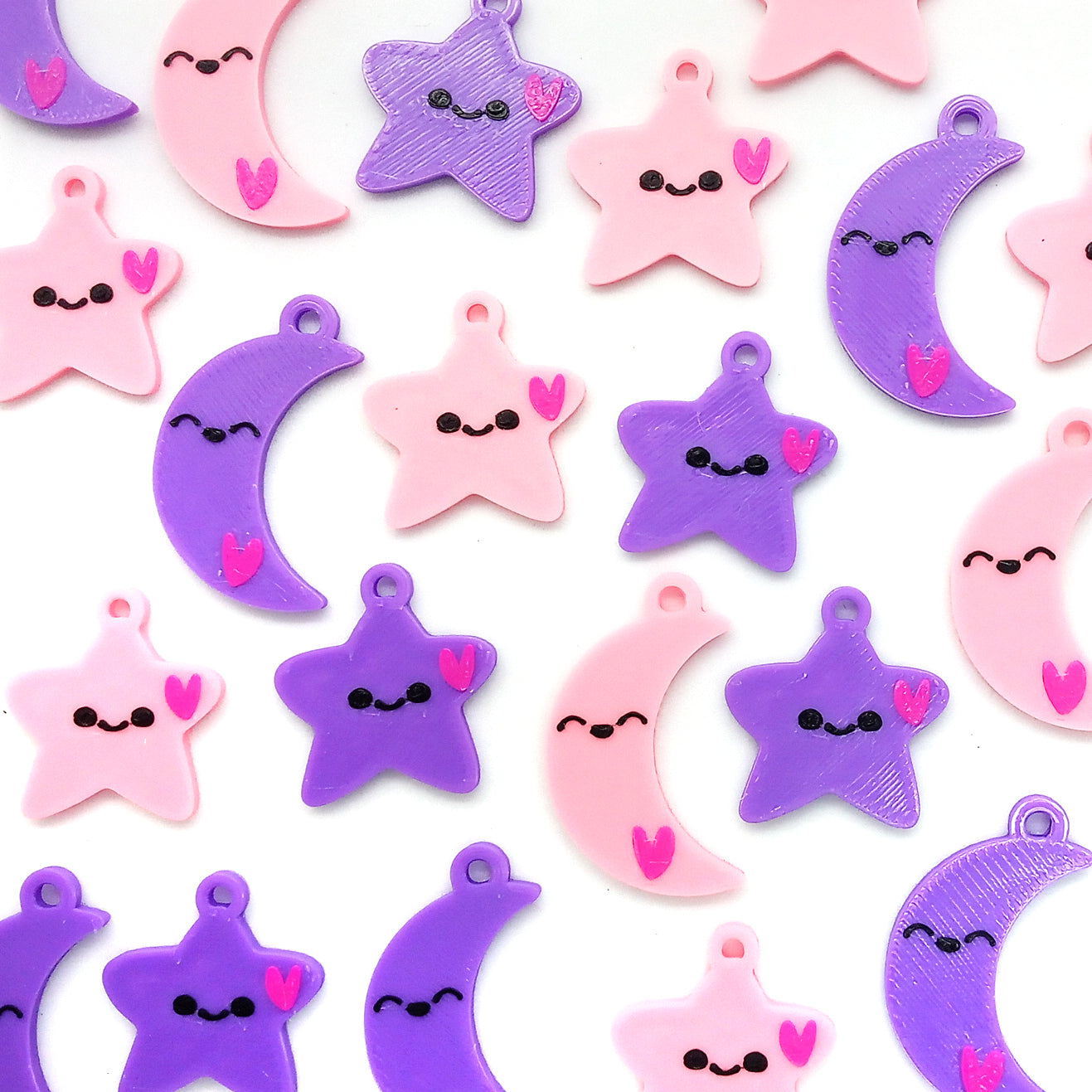 Cute pink and purple kawaii smiling stars and moon pendants.