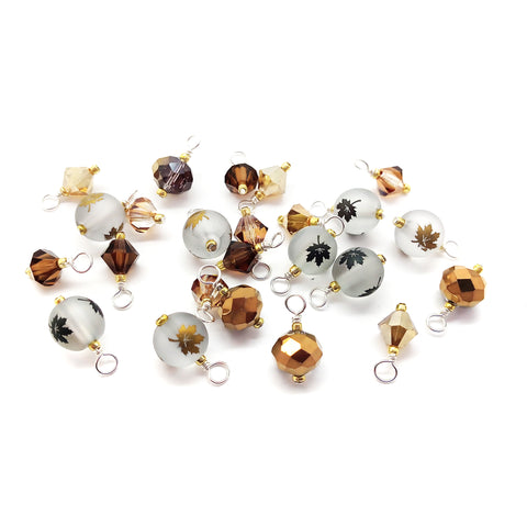 Pretty bead dangle charms in brown and gold with autumn leaves.