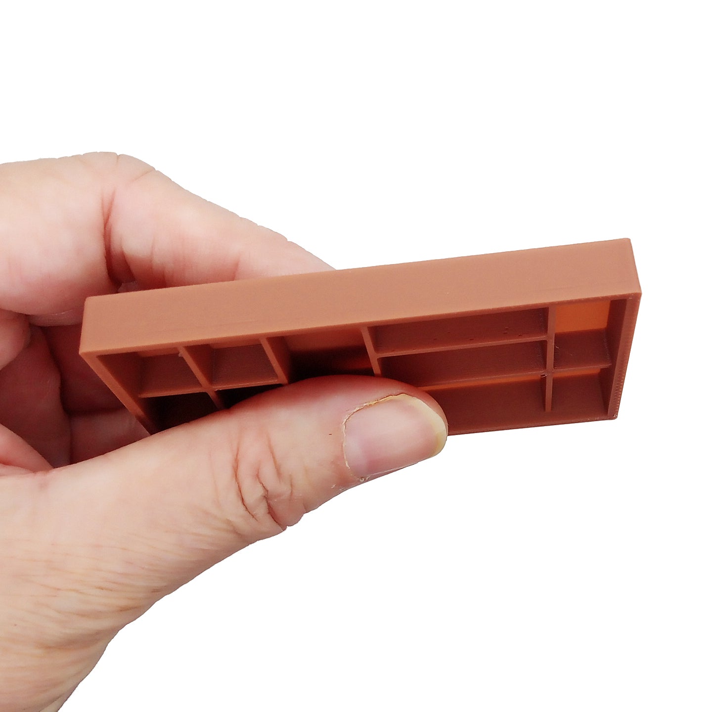 Miniature dollhouse printer tray, sahdow box, or trinket shelf, held in hand.