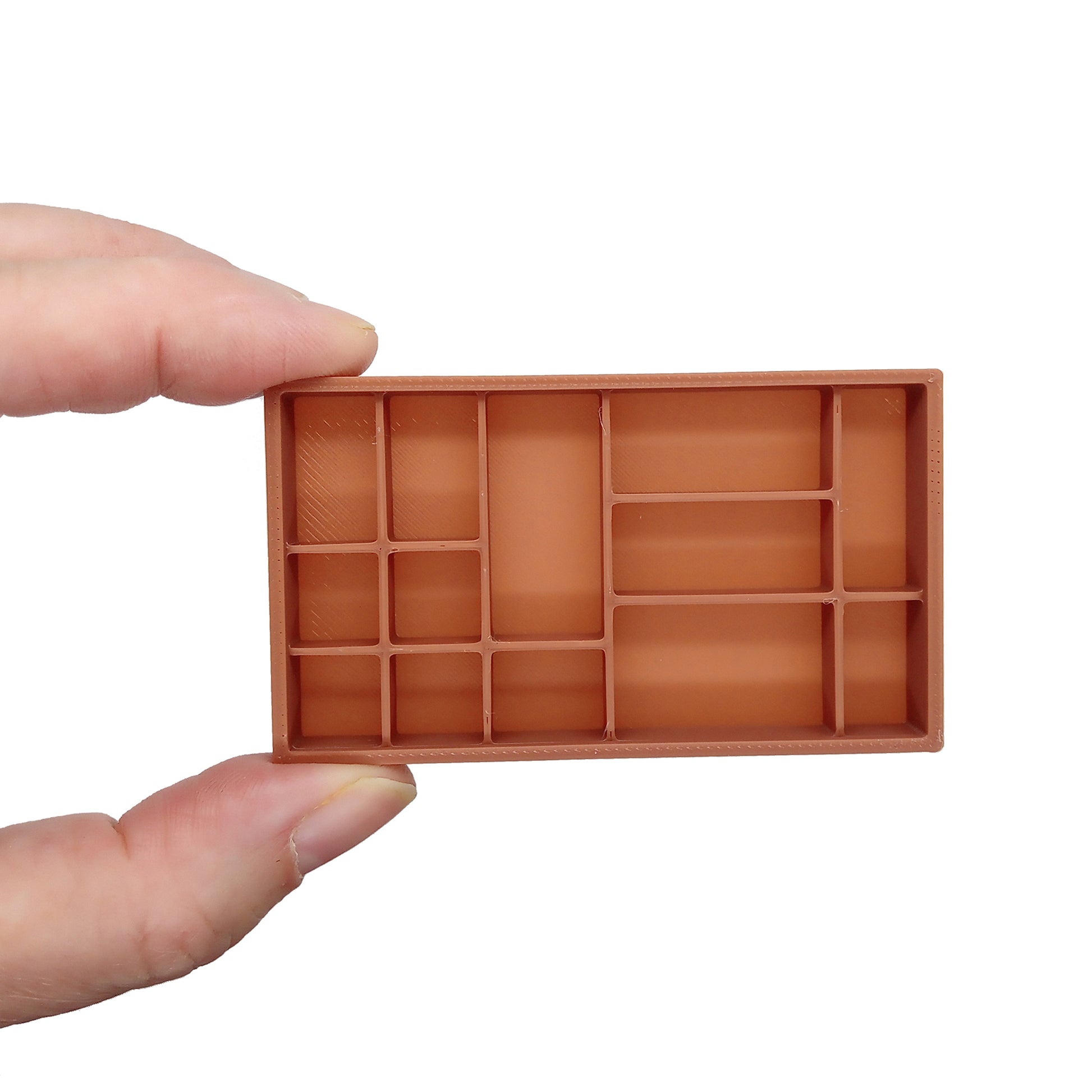 Miniature dollhouse printer tray, sahdow box, or trinket shelf, held in hand.