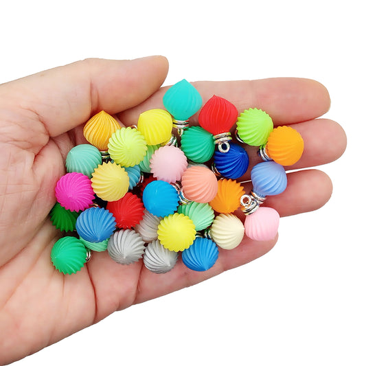 Tiny Christmas ornament charms or pendants in many colors, measuring about 5/8 long (1:12 scale).
