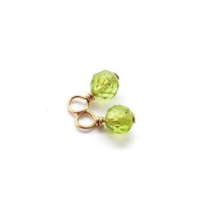 Tiny, dainty light green peridot charms are wire wrapped in 14K gold filled wire to make 4mm microfaceted dangles for August birthstone jewelry.