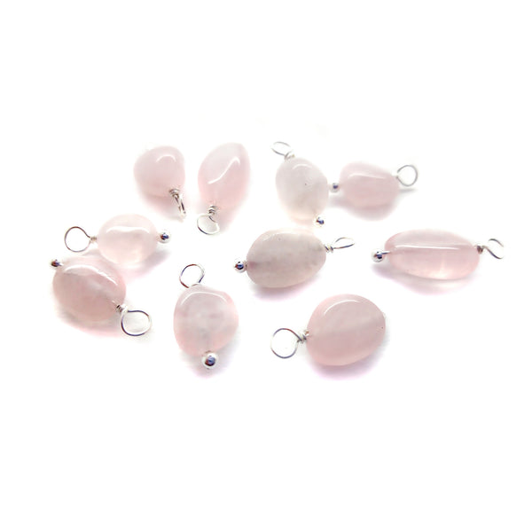 Rose quartz pastel pink beads made into gemstone dangle charms.
