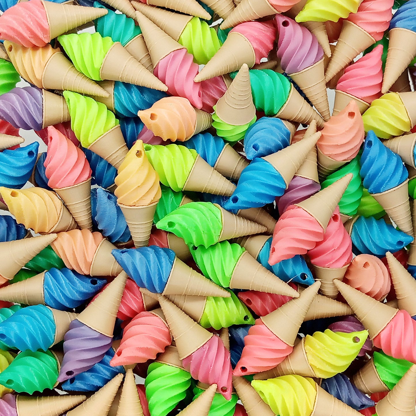 Lots of bright colorful sherbet fruit ice cream cone charms.