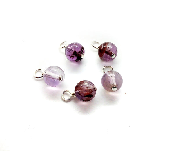 Melody Stone 6mm gemstone bead charms, made from a combination of amethyst, cacoxenite, goethite, lepidocrocite, rutile, smoky quartz, and quartz..