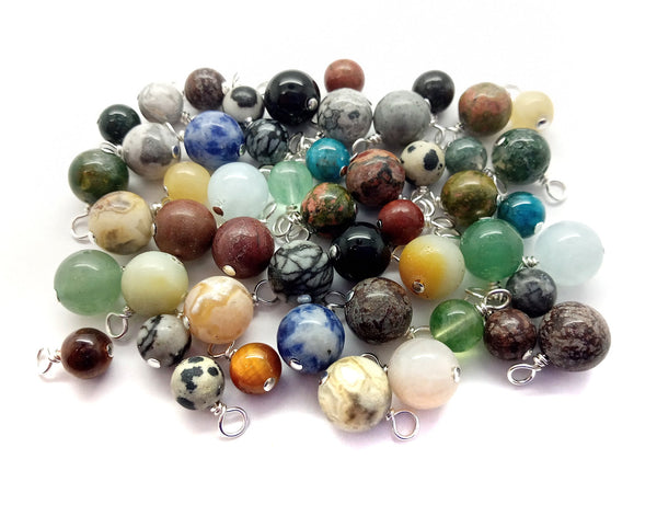 Various styles of 8mm to 6mm gemstone bead dangle charms, made by Adorabilities.